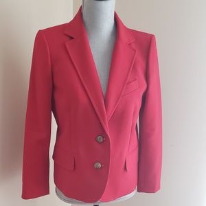 Suit with pleated skirt